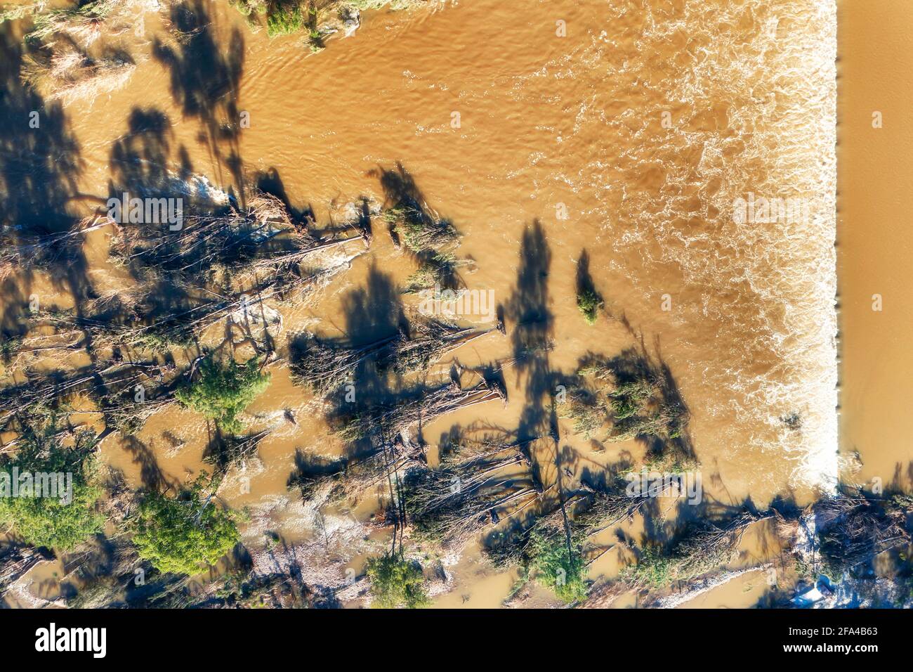 Aerial top down view over Nepean river Penrith Weir across flooded ...
