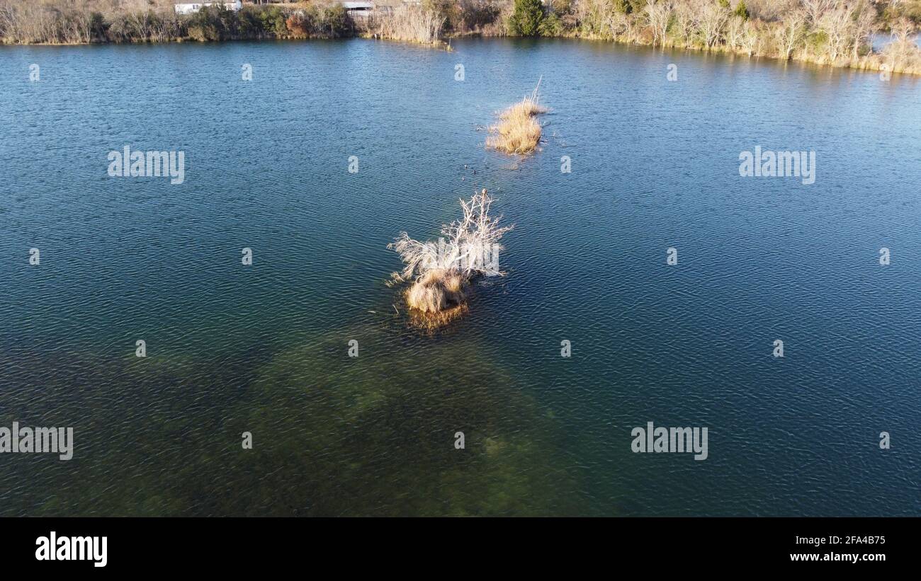 Coral island in pond near Houston, Texas, United States aerial photo taken by drone in 4k Stock Photo