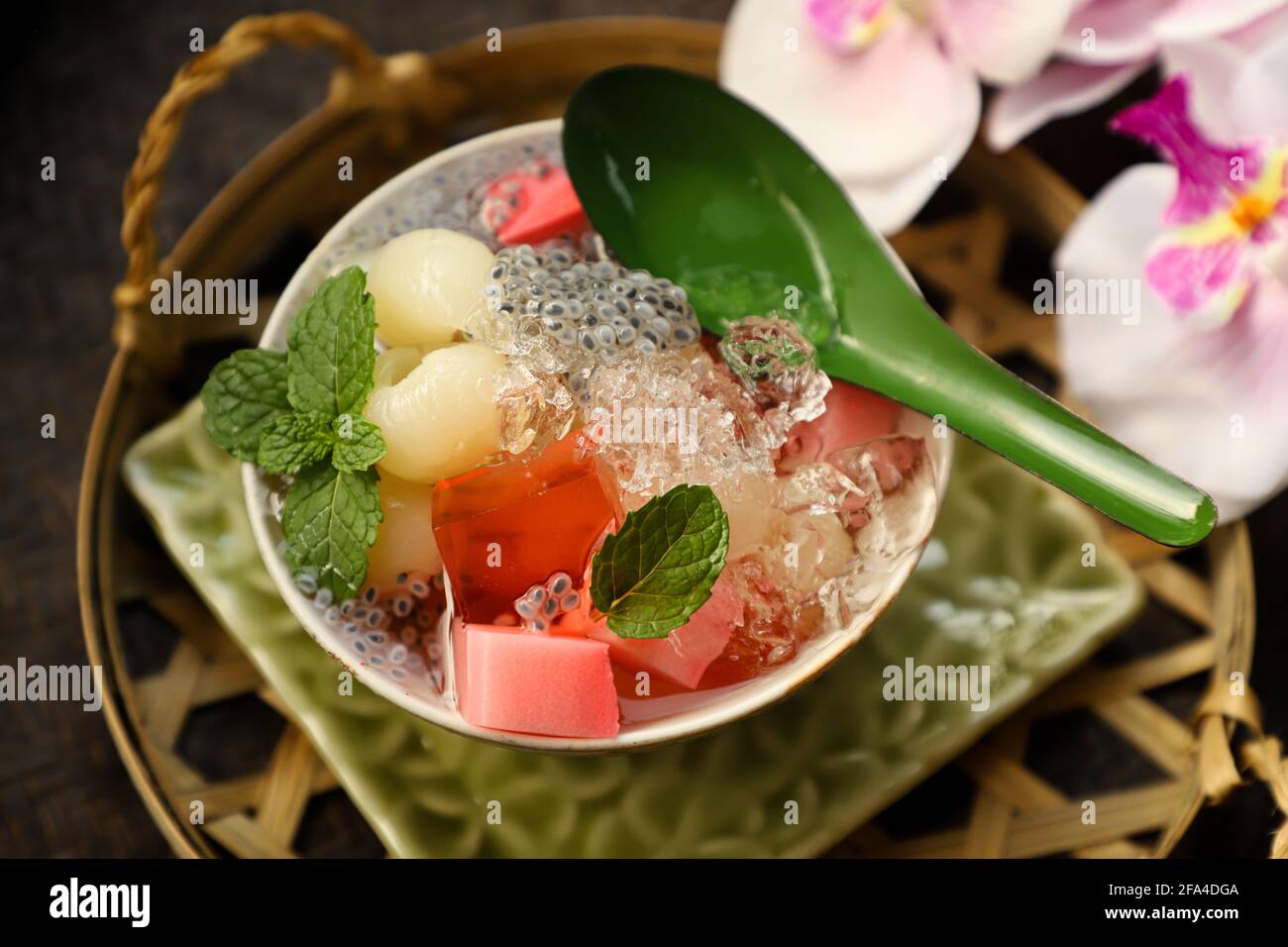 Iced Longan Jelly. Preserved longan fruit in syrup with red jelly, milk