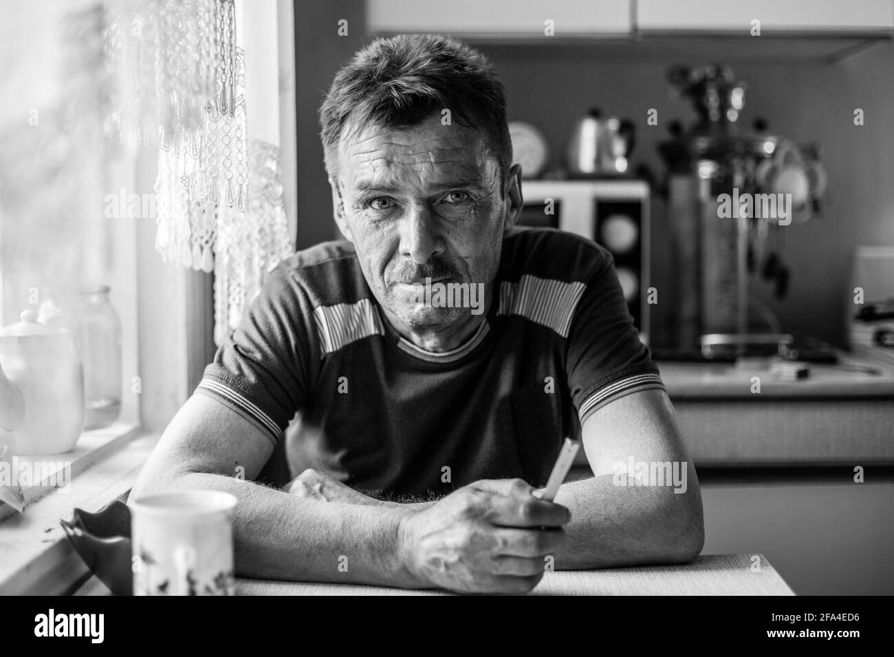 Portrait of male worker in his rural home. Black and white photo. Stock Photo