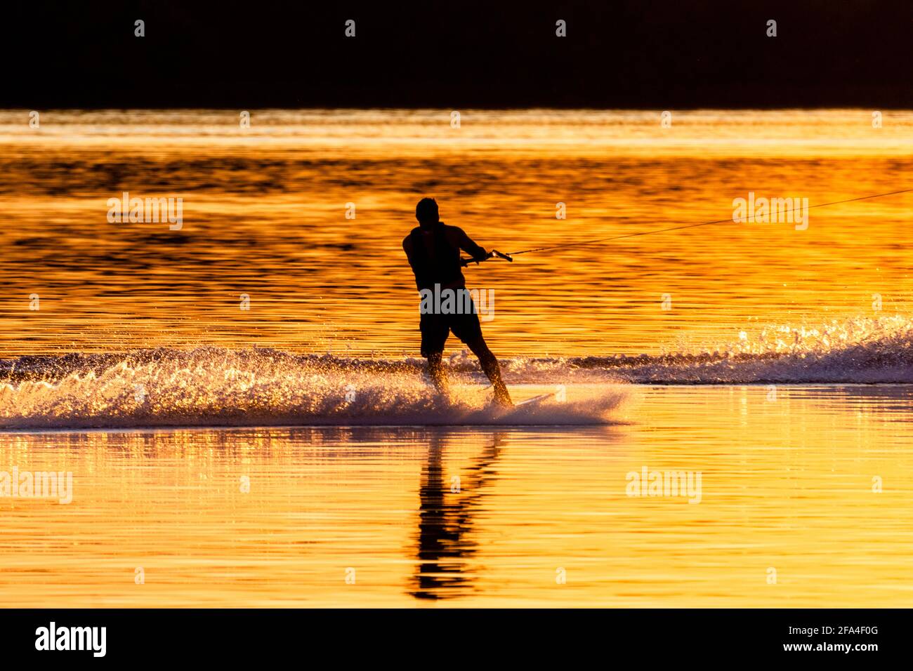 Silhouette of water skier at sunset on a Wisconsin Lake. Stock Photo