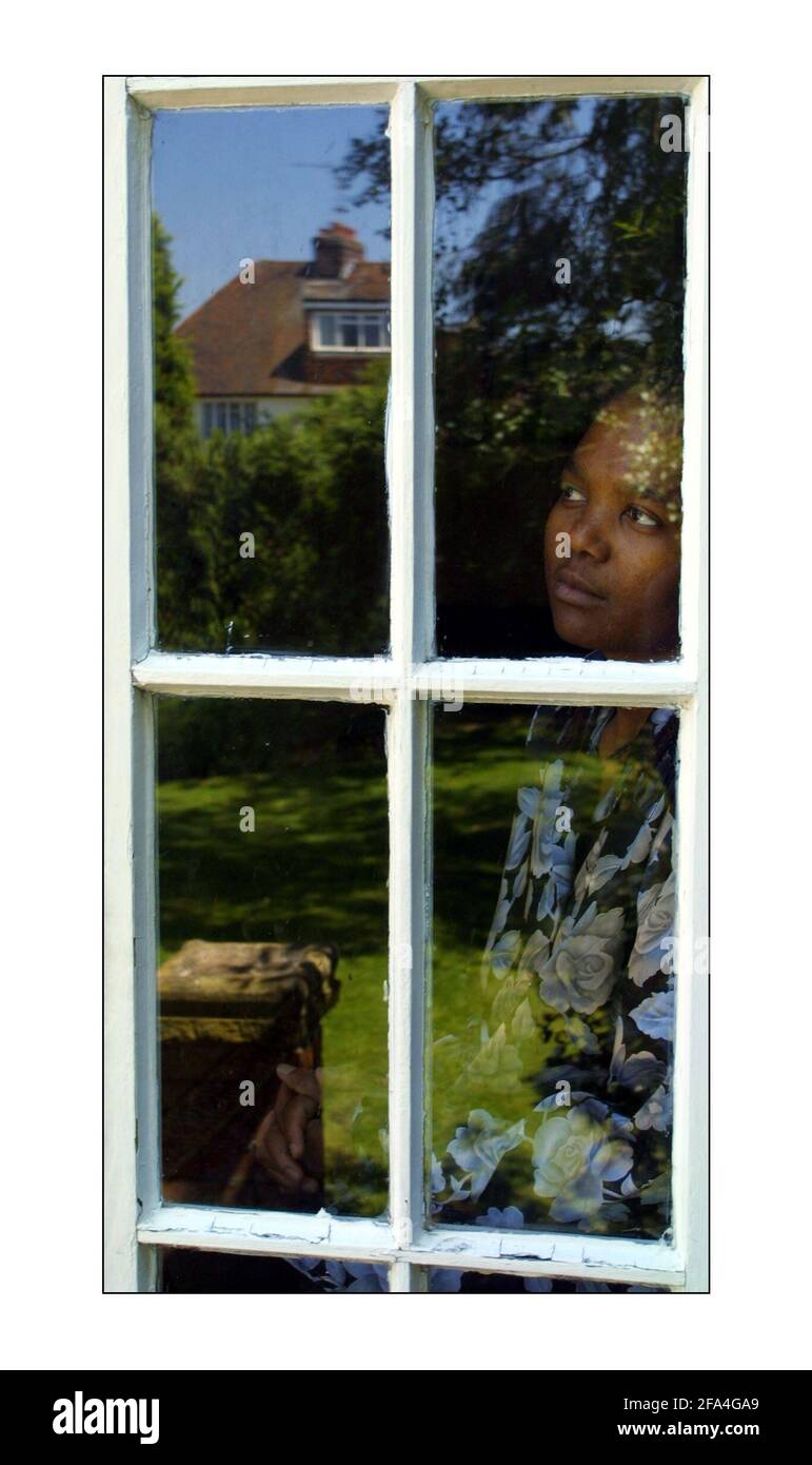 Lyndiwe Gumede (housemaid) stranded in London after her South African employer, with whom she traveled to the UK, refused to pay her and has kept her passport.pic David Sandison 26/6/2002 Stock Photo
