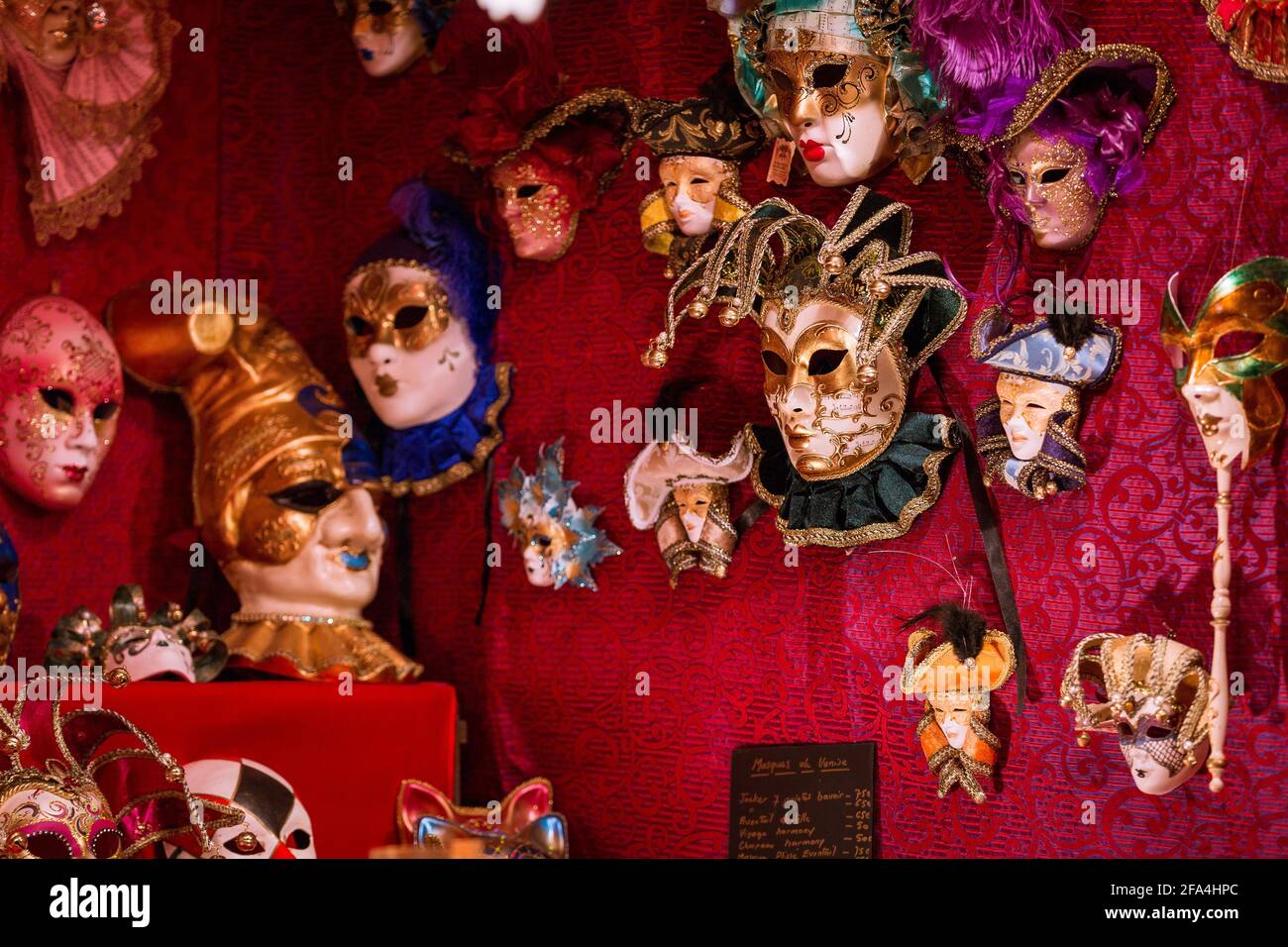 Colmar, France - December 22, 2014: Venetian masks inside one of the booths at the Colmar Christmas Market in Colmar, France. Stock Photo