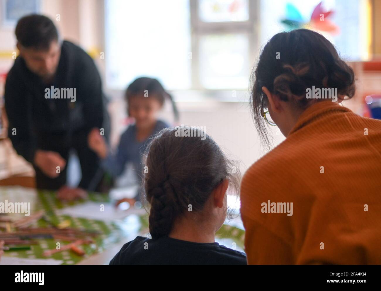 Berlin, Germany. 21st Apr, 2021. Children are looked after during leisure time care at the Arche in Hellersdorf. The association 'Die Arche Christliches Kinder- und Jugendwerk' runs leisure facilities and school care for socially disadvantaged children. Credit: Jens Kalaene/dpa-Zentralbild/dpa/Alamy Live News Stock Photo