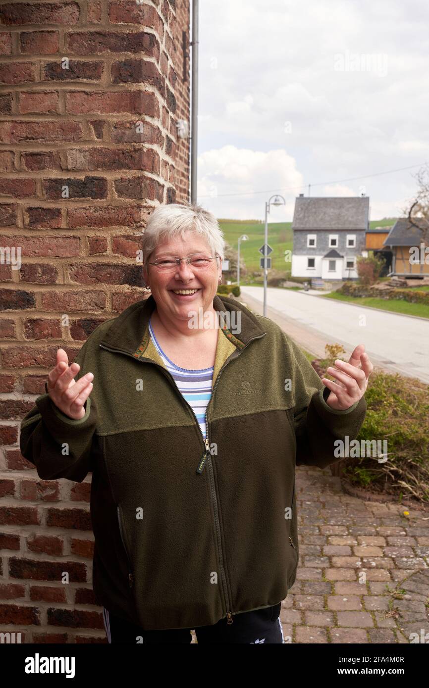 Korweiler, Germany. 20th Apr, 2021. Anke Wilhelm stands in front of her  house in the village of Korweiler in the Rhine-Hunsrück district. No  inhabitant of the village with 80 inhabitants has been