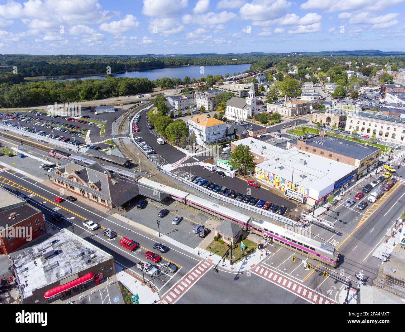 Aerial view of Armenian Church and Framingham MBTA train station and MBTA train in historic