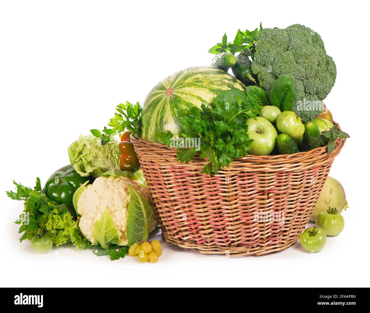 Fresh green vegetables in a wicker basket Stock Photo - Alamy