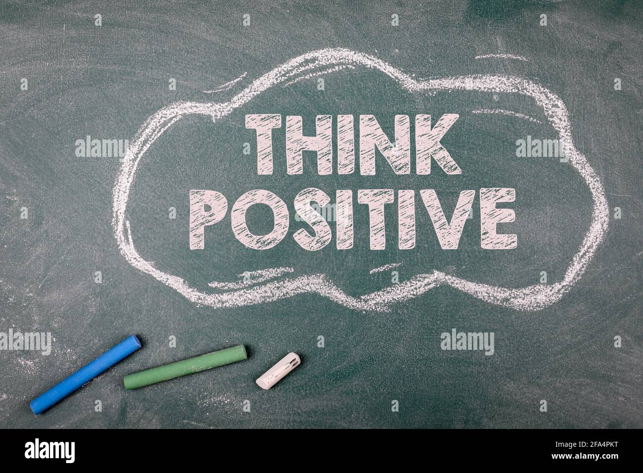 Think Positive. Cloud on a green chalk board. Stock Photo