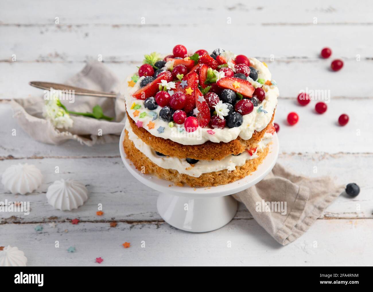 Delicious homemade cake with fresh berries and mascarpone cream on wooden background. Top view, copy space Stock Photo