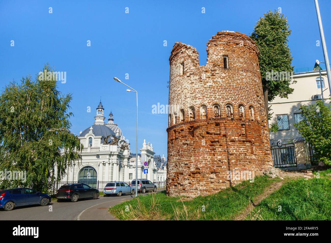 Ancient watchtower, remote building of Kazan Kremlin complex. Building of Farmers' Palace is visible in background. Shot in Kazan, Russia Stock Photo