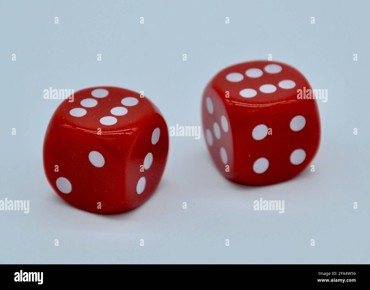 Pair of sixes on red casino dice in a studio shot on a white background Stock Photo