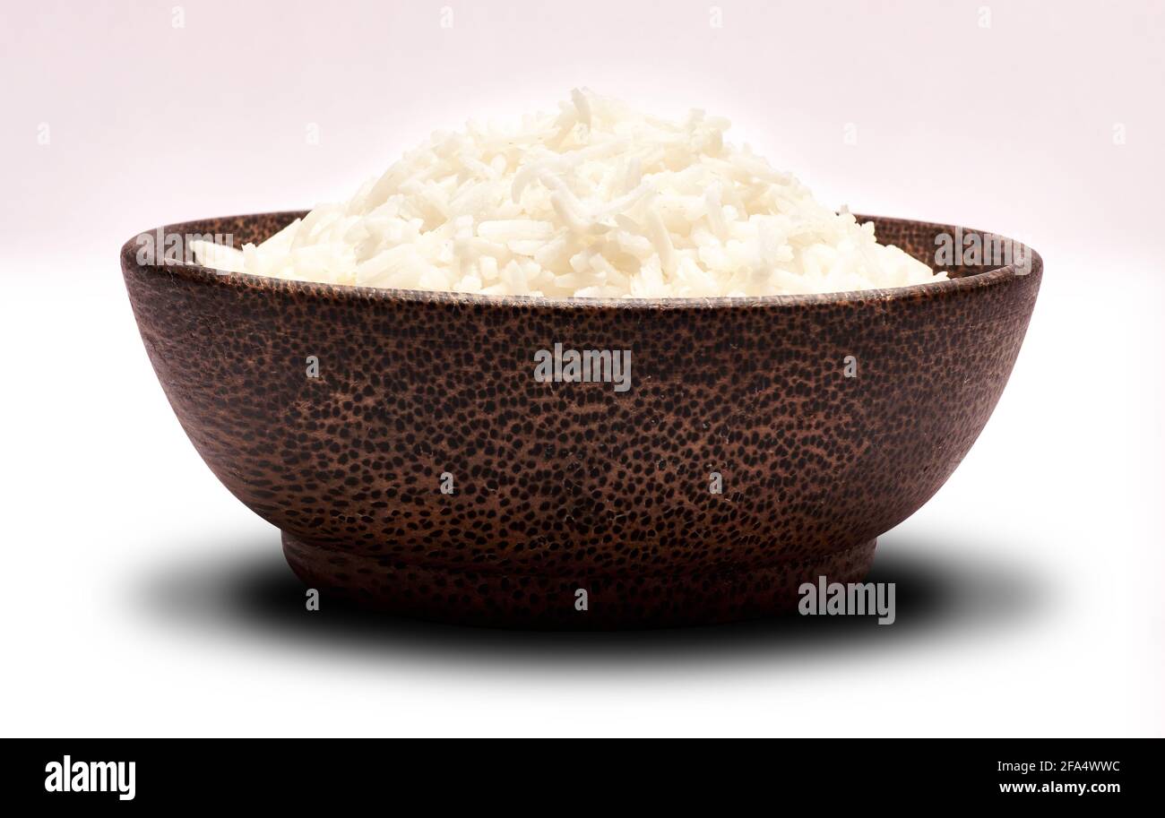 Boiled Rice in a wooden bowl isolated on a white background with ...