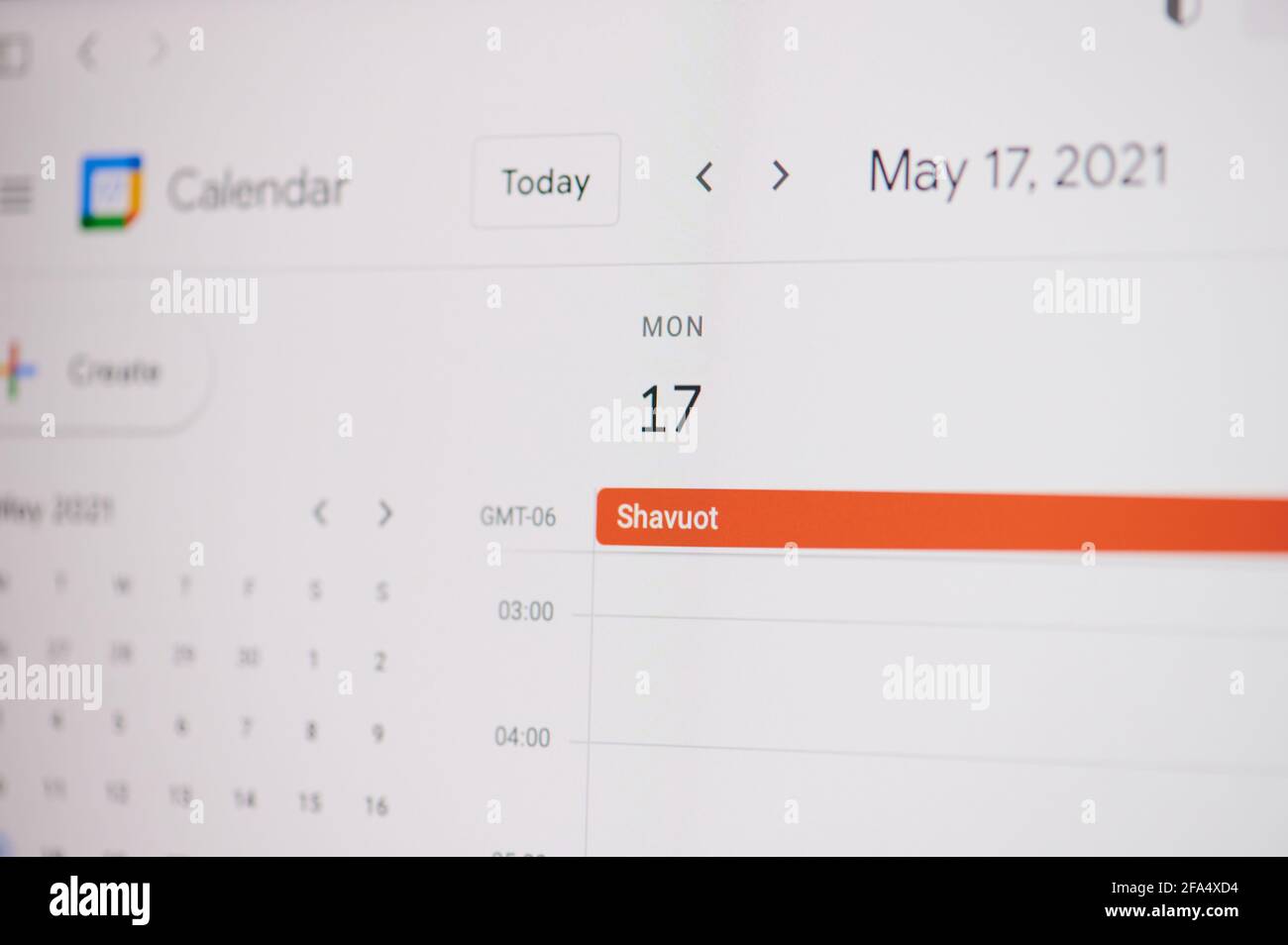 New york, USA - February 17, 2021: Shavuot 17 of may on google calendar on laptop screen close up view. Stock Photo