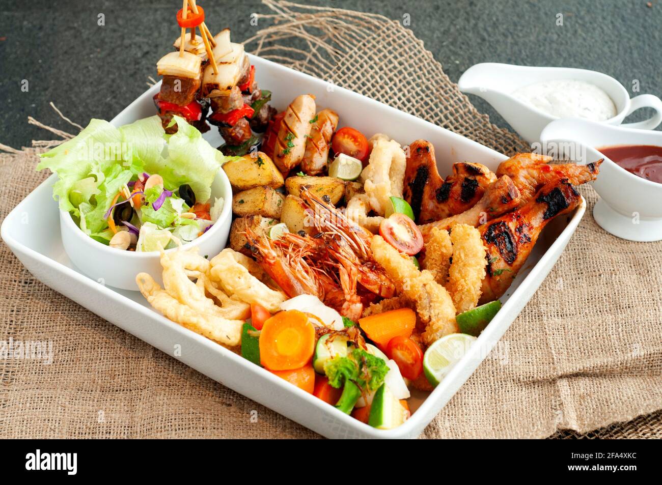 seafood platter, a seafood cuisine with vegetable salad Stock Photo Alamy