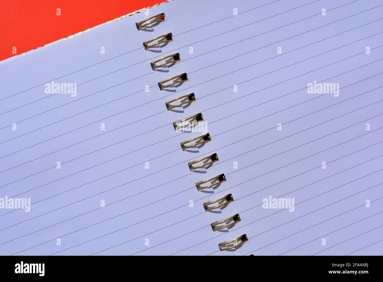 Spiral bound notebook, open with empty lined pages Stock Photo