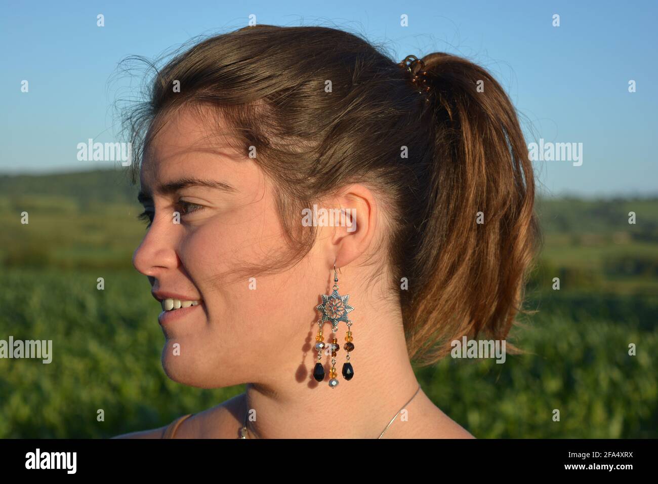 Woman with earrings hi-res stock photography and images - Alamy