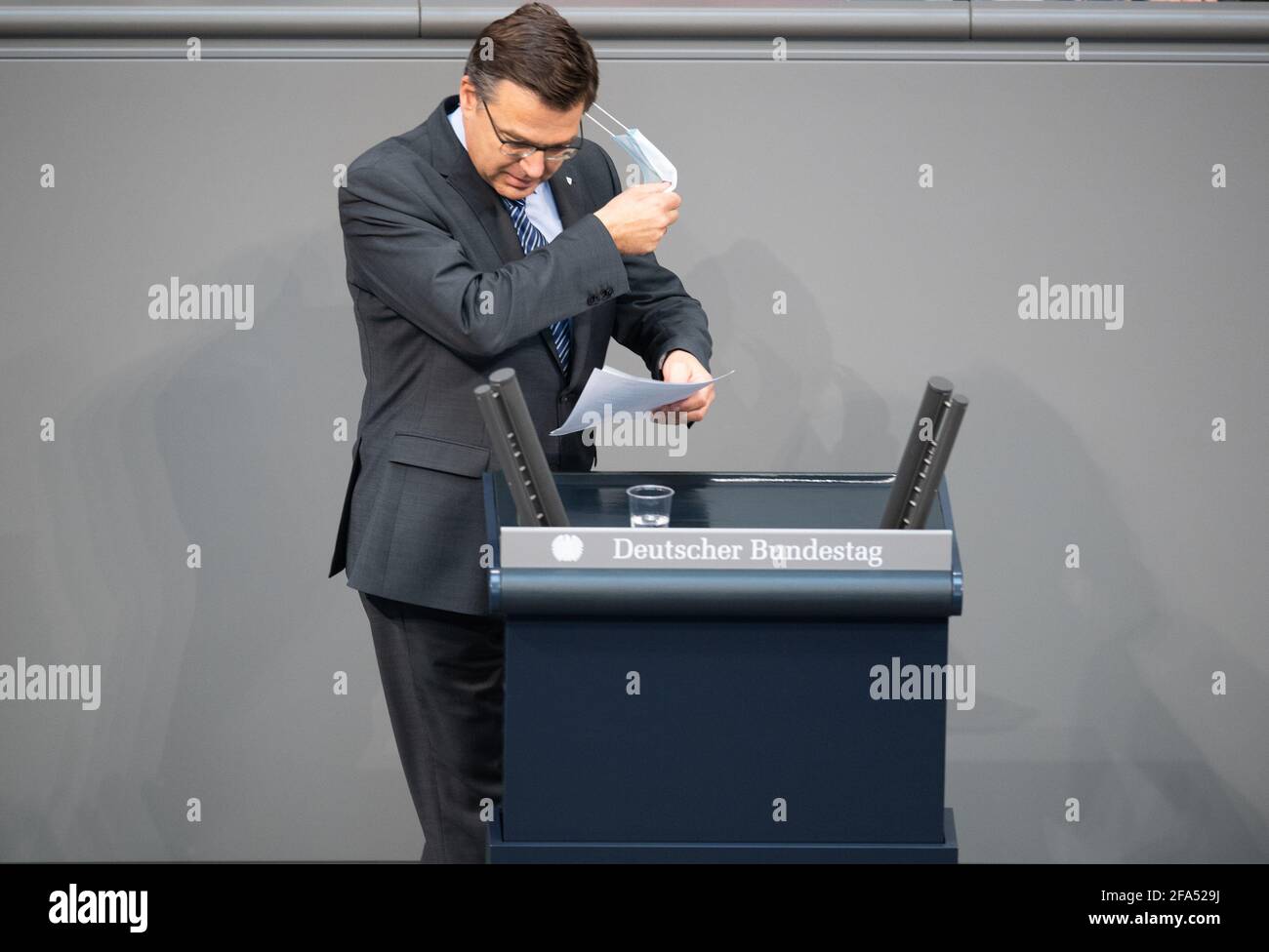 23 April 2021, Berlin: Volker Münz (AfD), comes to the speaker's podium in the Bundestag. The topic is the adoption of the supplementary budget. Photo: Christophe Gateau/dpa Stock Photo