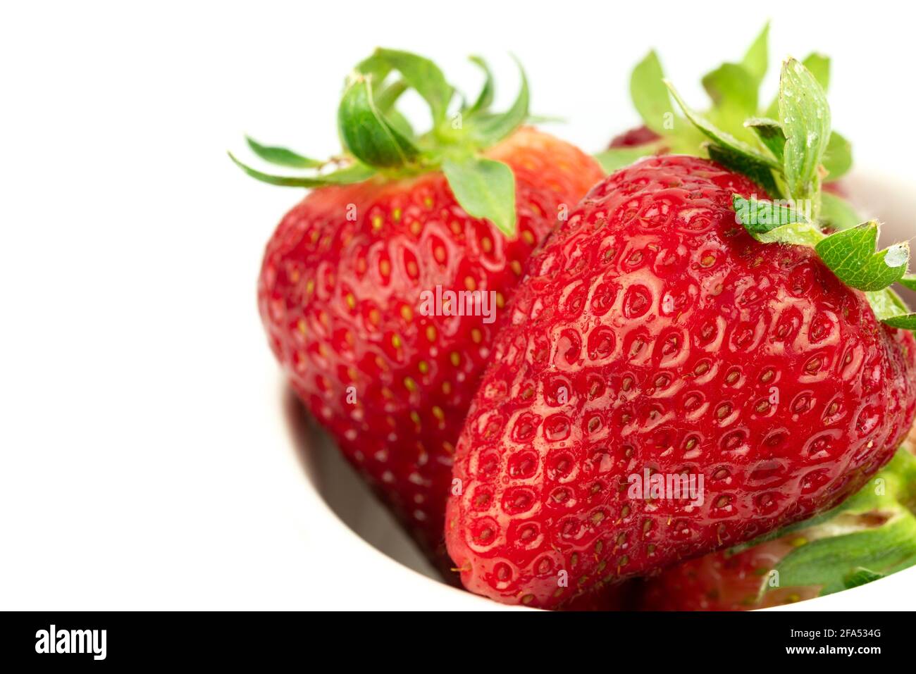 close up take of fresh strawberries with white background Stock Photo ...