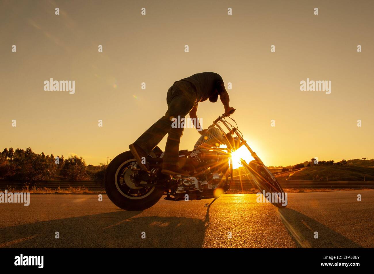 motorcyclist turns on the motorcycle Stock Photo