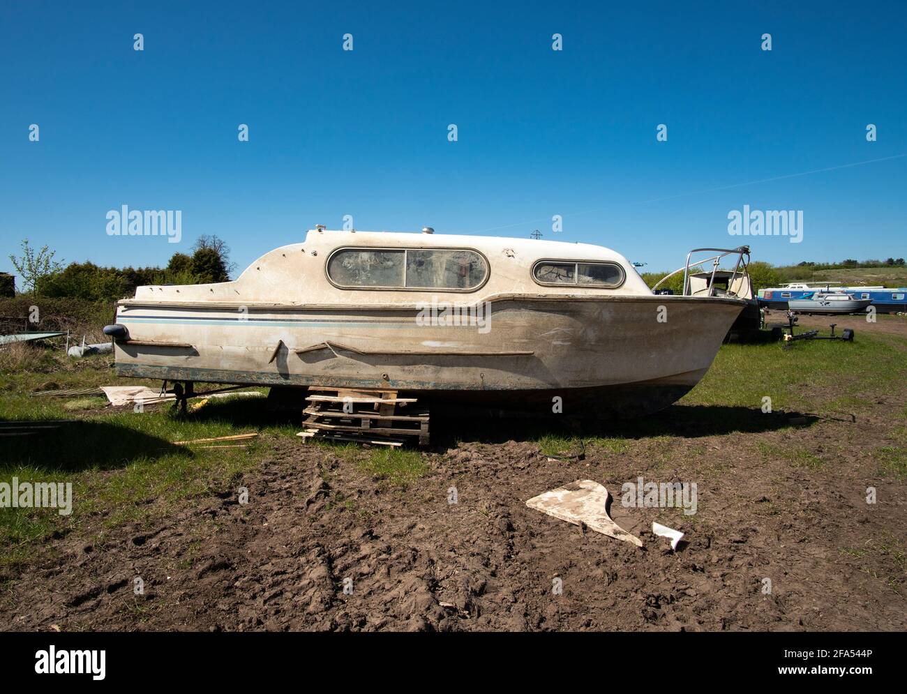 Dirty old motor boat in a salvage yard Stock Photo Alamy
