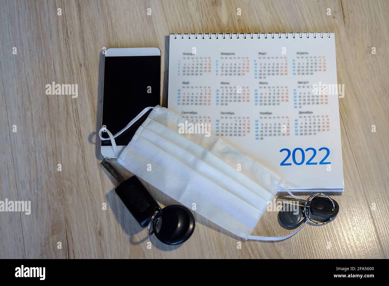 Phone and calendar 2022. Medical mask and calendar 2022. Keys and mask