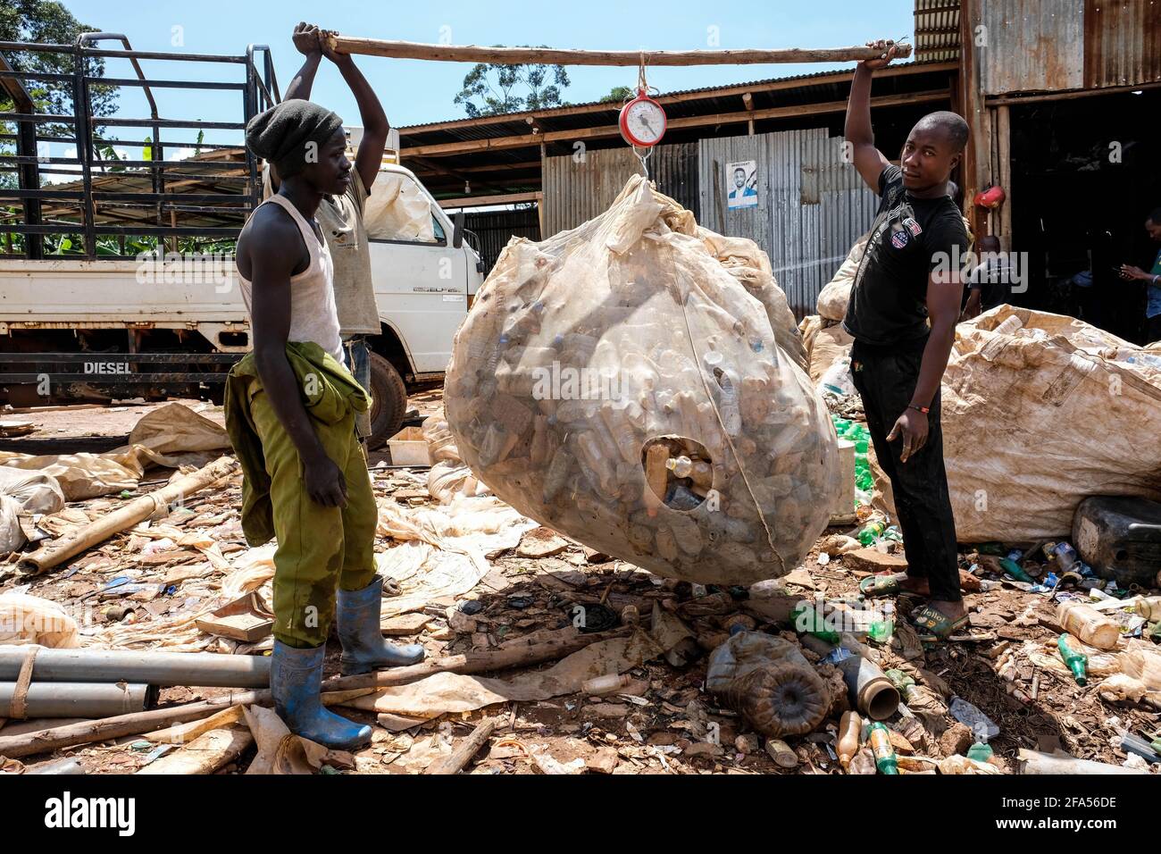 Kampala, Uganda. 24th Mar, 2021. Workers of Eco Ways Uganda weigh