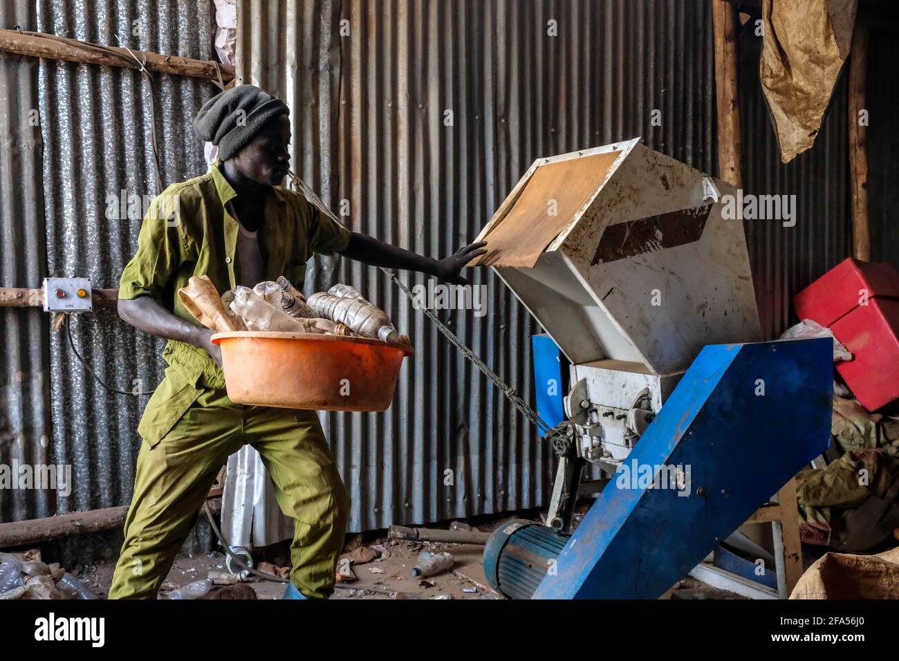 Kampala, Uganda. 24th Mar, 2021. A worker of Eco Ways Uganda prepares