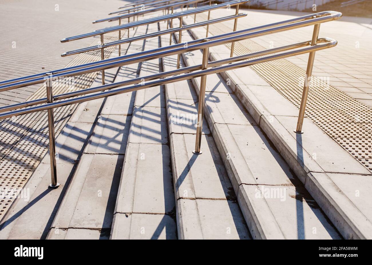 shiny metal railing on the stairs in the city. Safe environment and ...