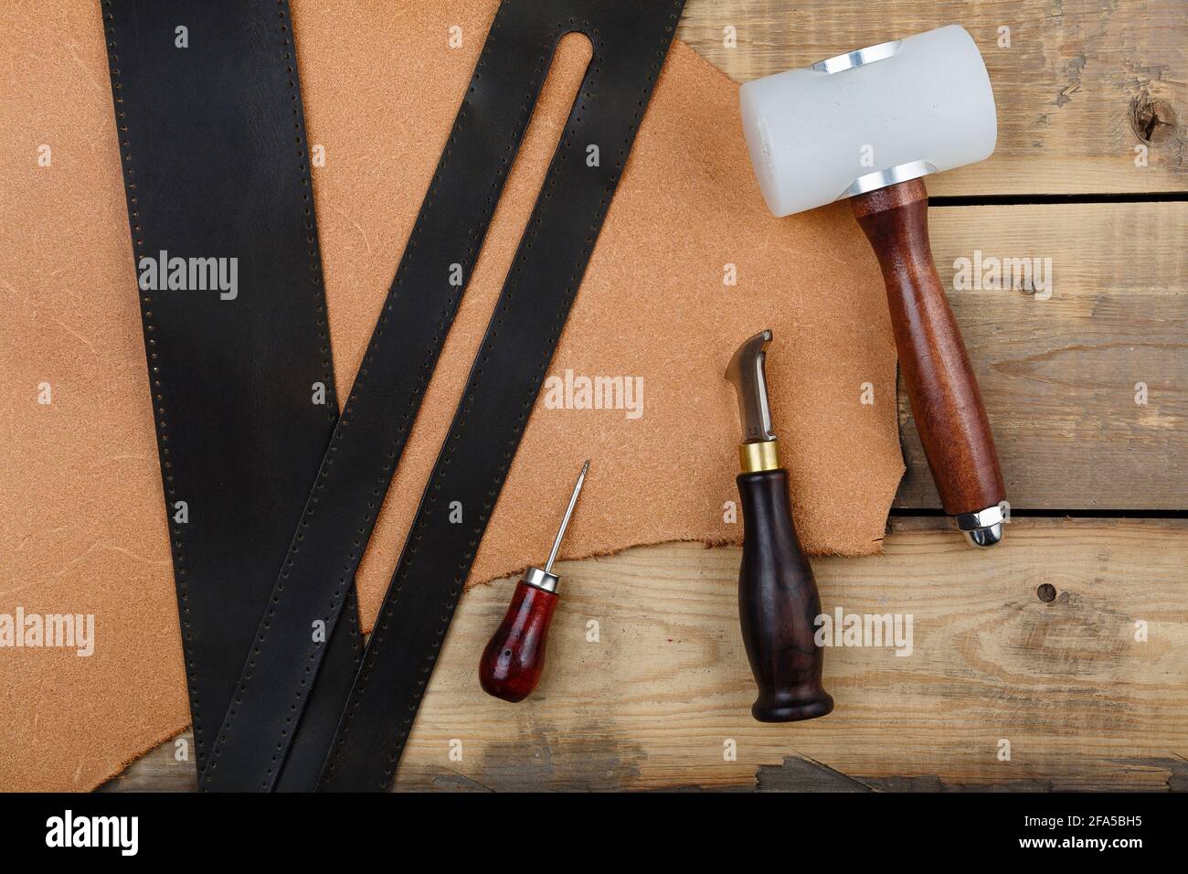 Leatherworker's tools on a wooden workbench Stock Photo Alamy