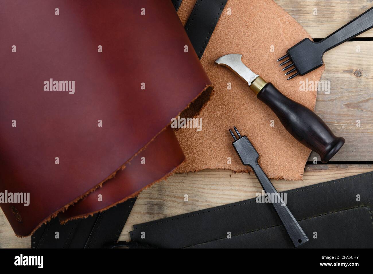 Leatherworker's tools on a wooden workbench Stock Photo Alamy