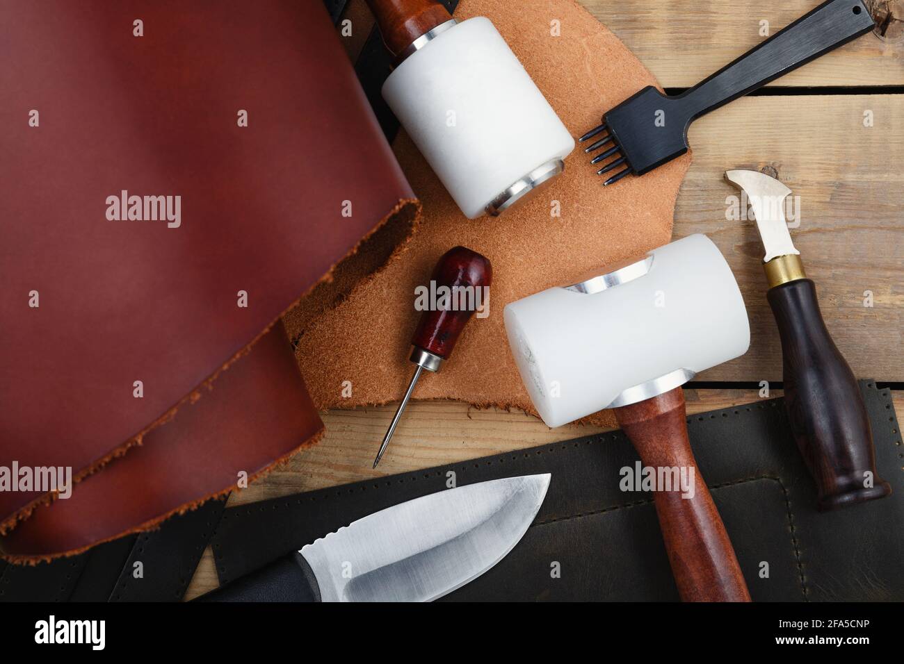 Leatherworker's tools on a wooden workbench Stock Photo Alamy