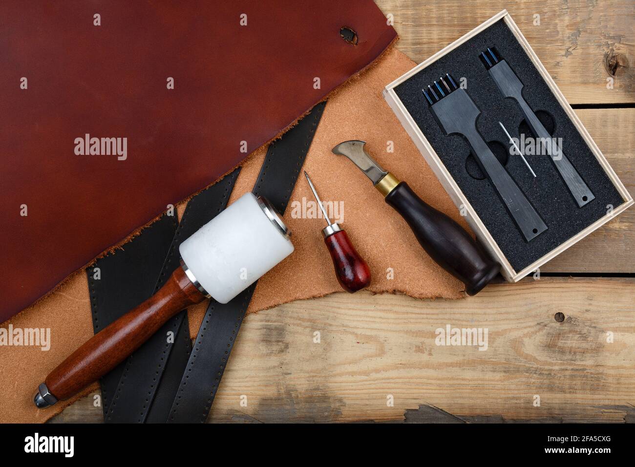 Leatherworker's tools on a wooden workbench Stock Photo Alamy