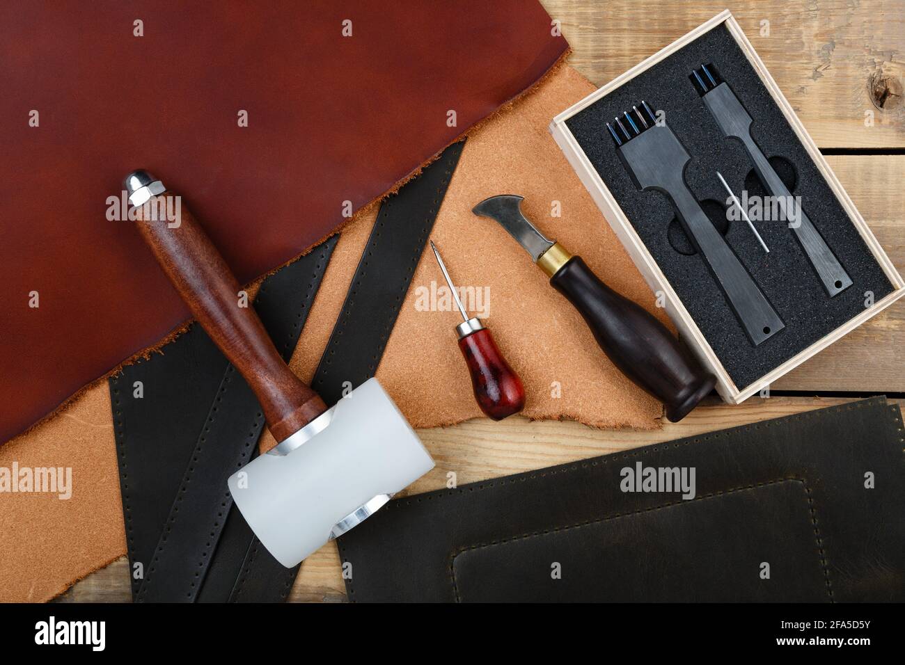 Leatherworker's tools on a wooden workbench Stock Photo Alamy