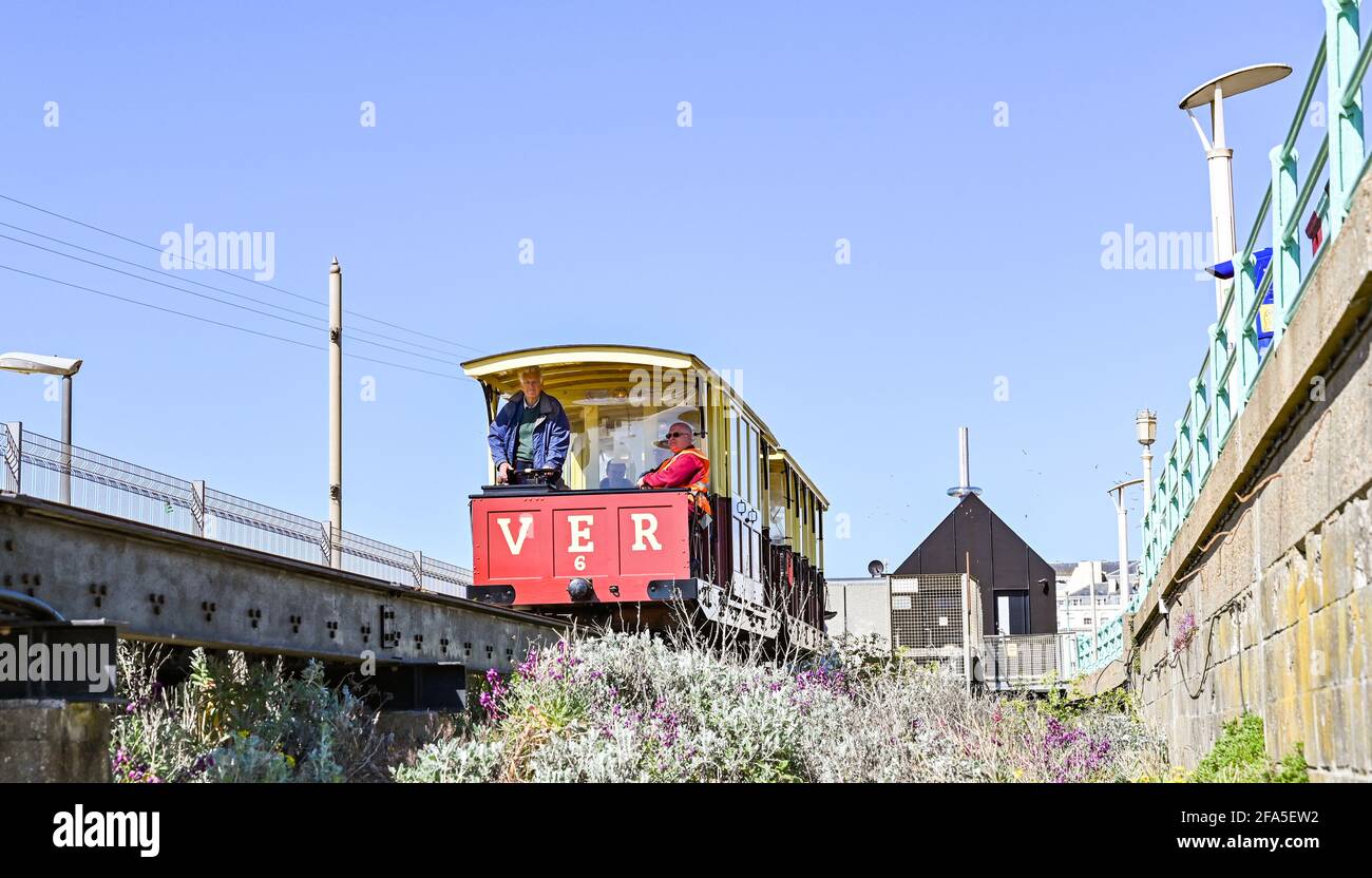 Brighton UK 23rd April 2021 - Volunteers including BBC newsreader Nicholas Owen (front left) on the Volks Electric Railway on Brighton seafront today as they prepare to reopen in late May for the summer season . The Volk's Railway was the first public electric railway in the world and was opened in 1883 by Magnus Volk.  :  Credit Simon Dack / Alamy Live News Stock Photo