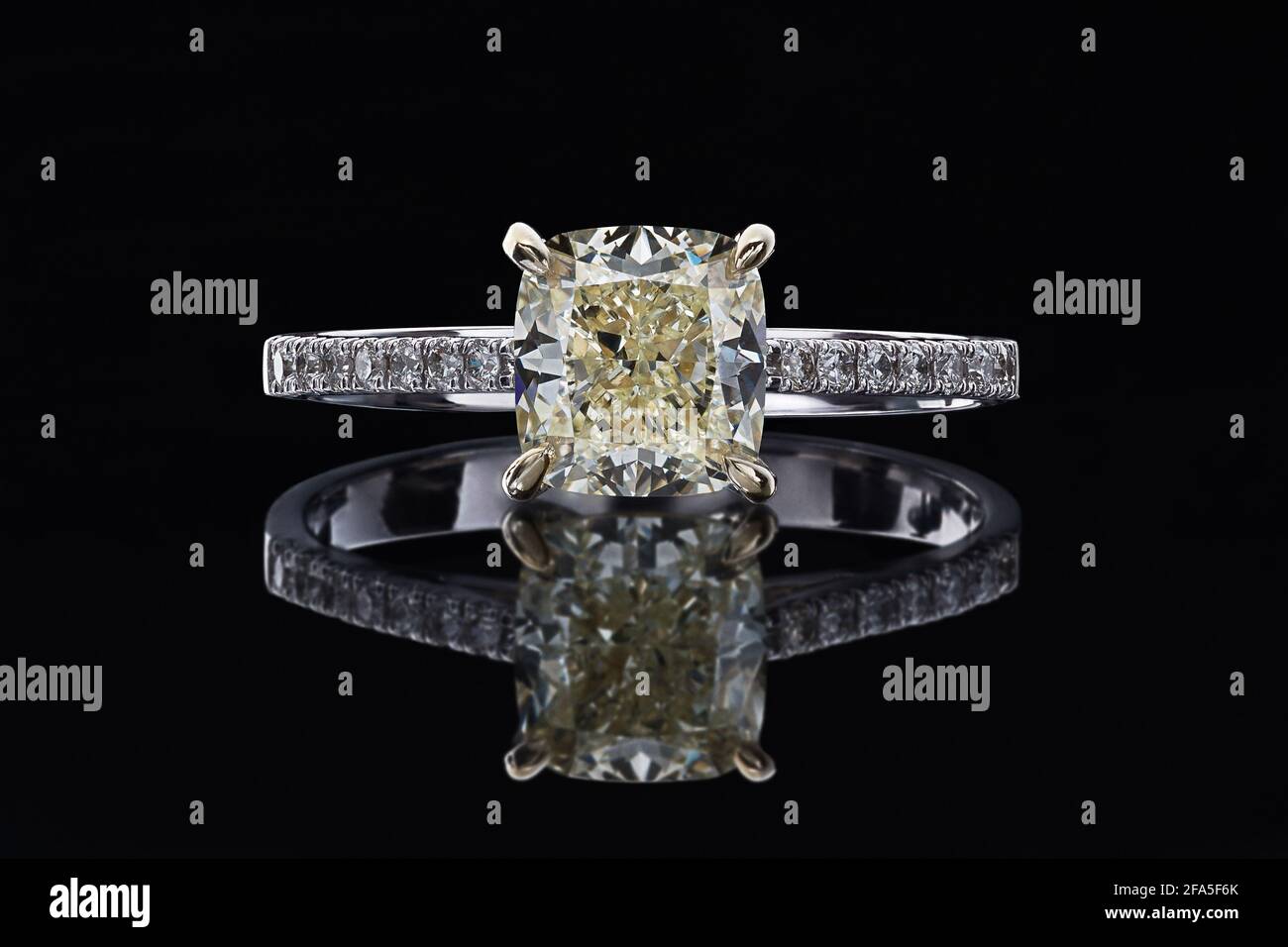 Ring with diamonds on a black background, with reflection. Stock Photo