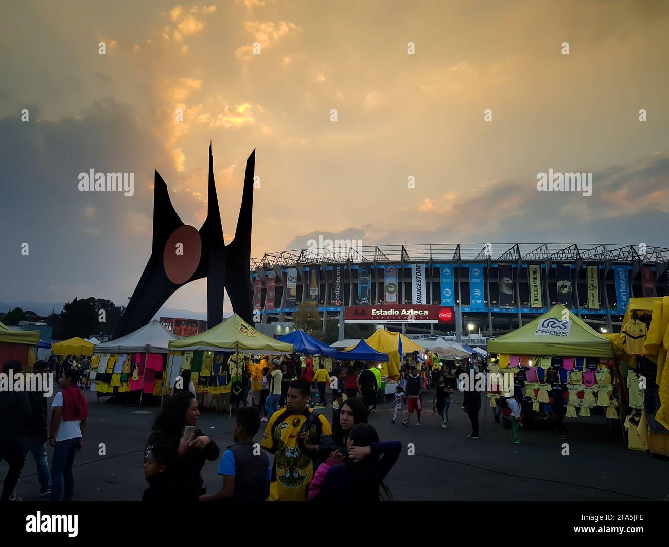Azteca Stadium in a match day. Beautiful sunset. Crowd arriving at stadium. America vs Puebla. Stock Photo