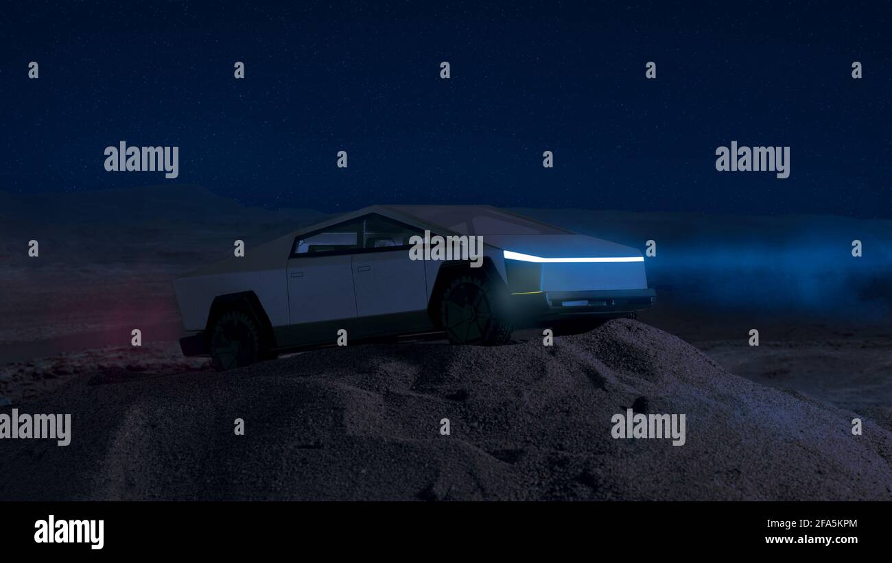Izmir, Turkey - April 20, 2021: Close up shot Tesla Cybertruck handcrafted model car on sand and with a Mars background night scene which taken from N Stock Photo