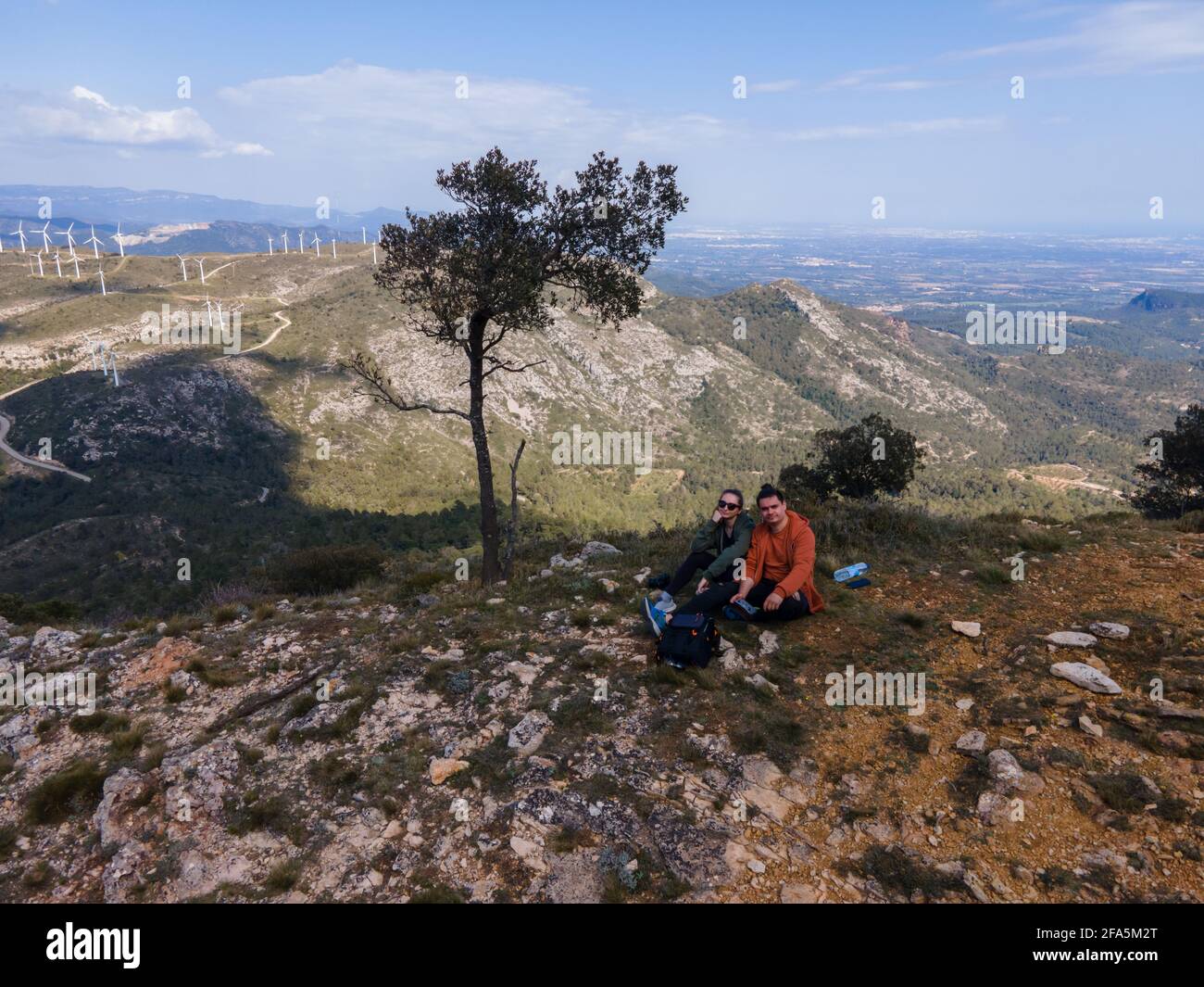 Couple sitting on top hill hi-res stock photography and images - Alamy