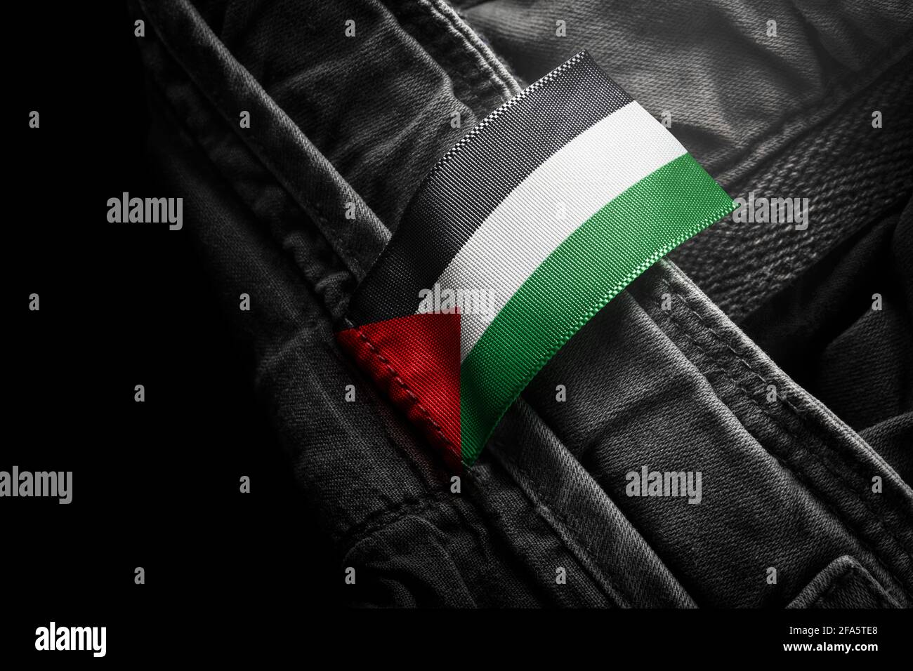 Tag on dark clothing in the form of the flag of the Palestine Stock Photo