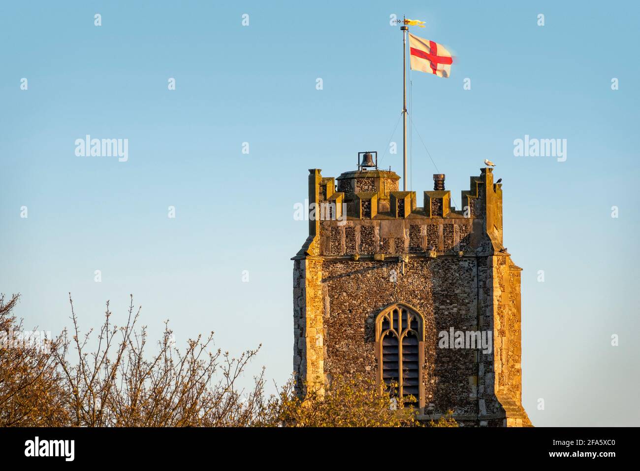 St George's flag flying at St Peter and St Paul's Church, Aldeburgh, UK, in celebration of Queen Elizabeth's birthday Stock Photo