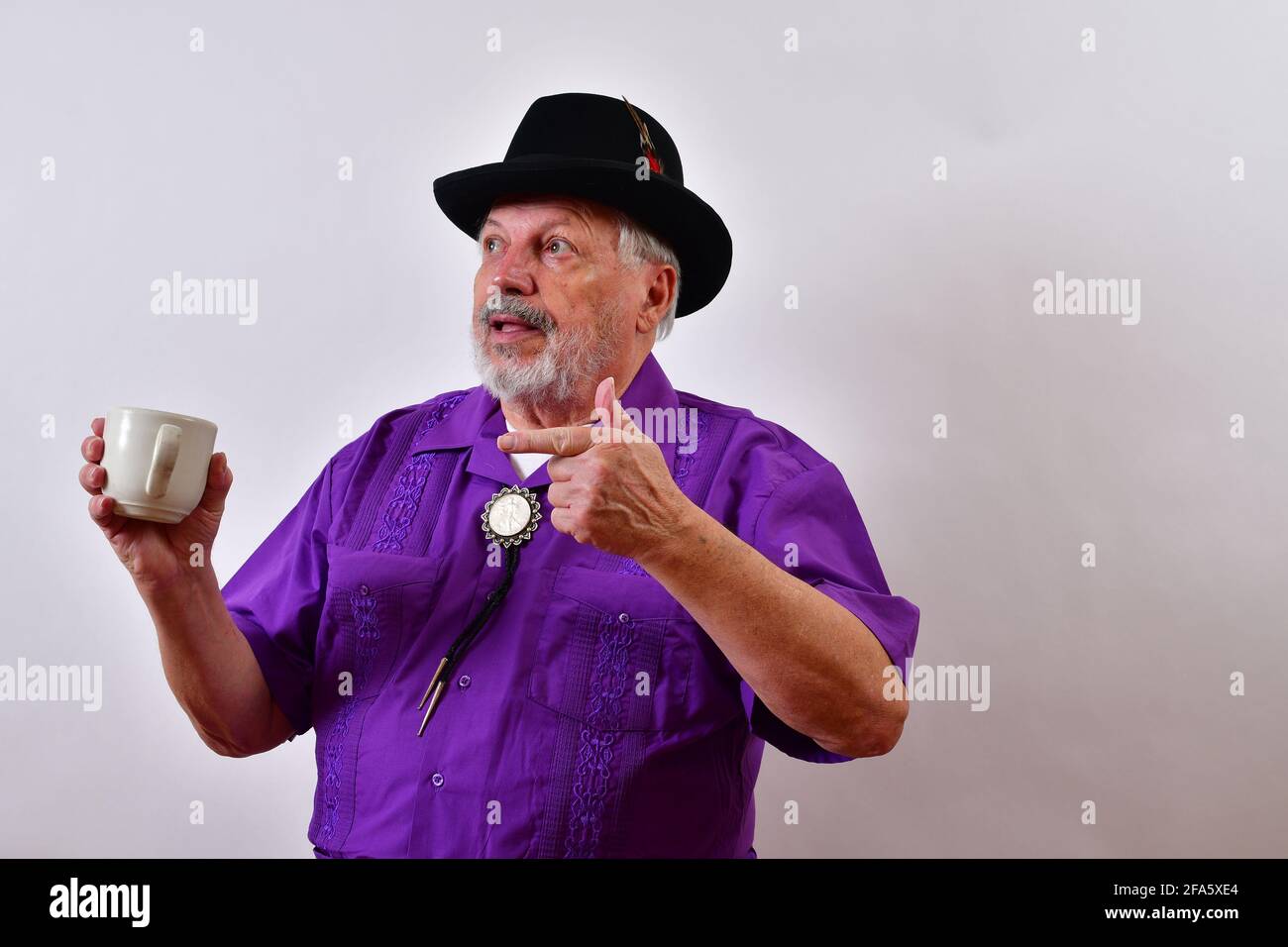 Elderly American gentleman planning while drinking coffee Stock Photo
