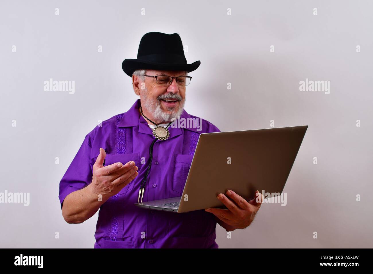 Cheerful senior American man using his laptop Stock Photo
