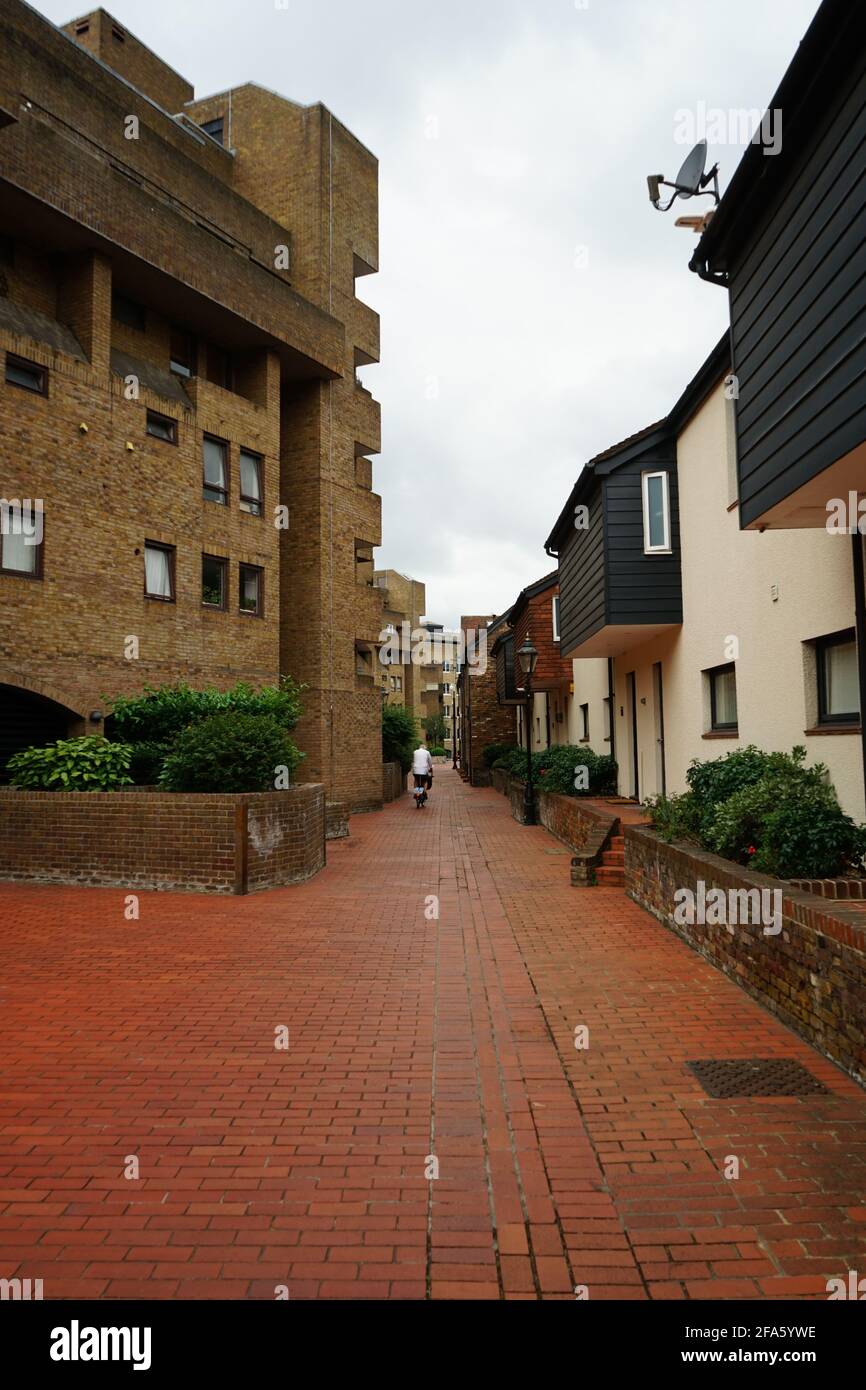A narrow passage way between flats at St. Katherine s Dock in London, England, U.K Stock Photo