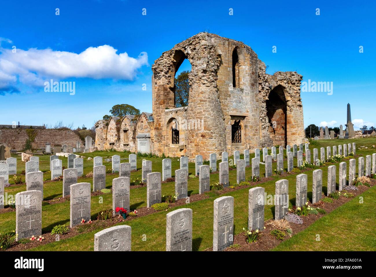 KINLOSS ABBEY MORAY SCOTLAND SIGNIFICANT REMAINS OF THE BUILDING WITH ROWS OF COMMONWEALTH AIR FORCE WAR GRAVES Stock Photo
