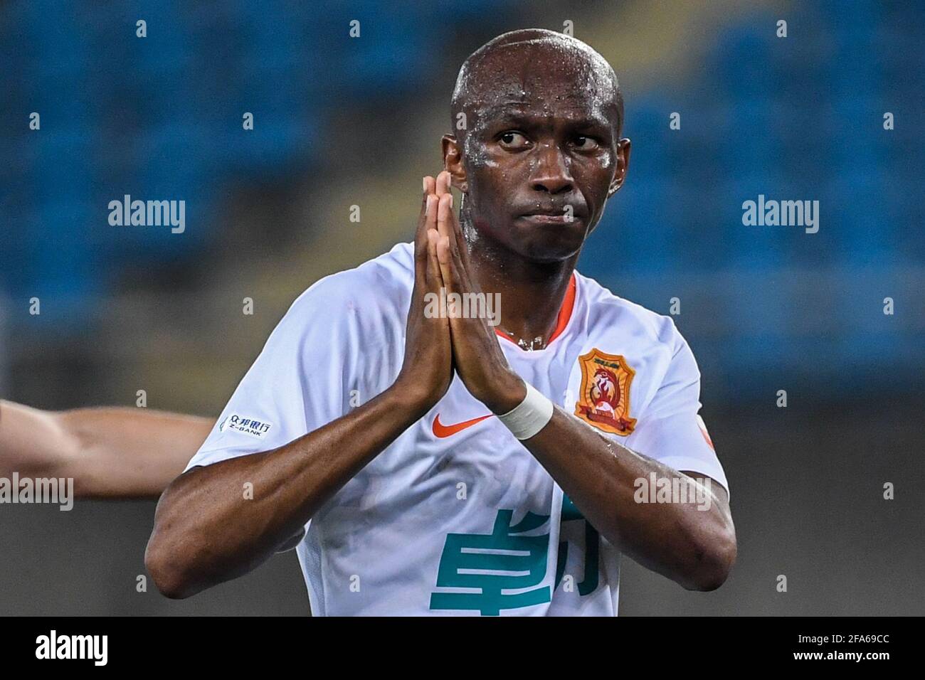 Suzhou, China's Jiangsu Province. 23rd Apr, 2021. Stephane Mbia of Wuhan FC reacts during the 1st round match between Hebei FC and Wuhan FC at the 2021 season Chinese Football Association Super League (CSL) Suzhou Division in Suzhou, east China's Jiangsu Province, April 23, 2021. Credit: Li Bo/Xinhua/Alamy Live News Stock Photo