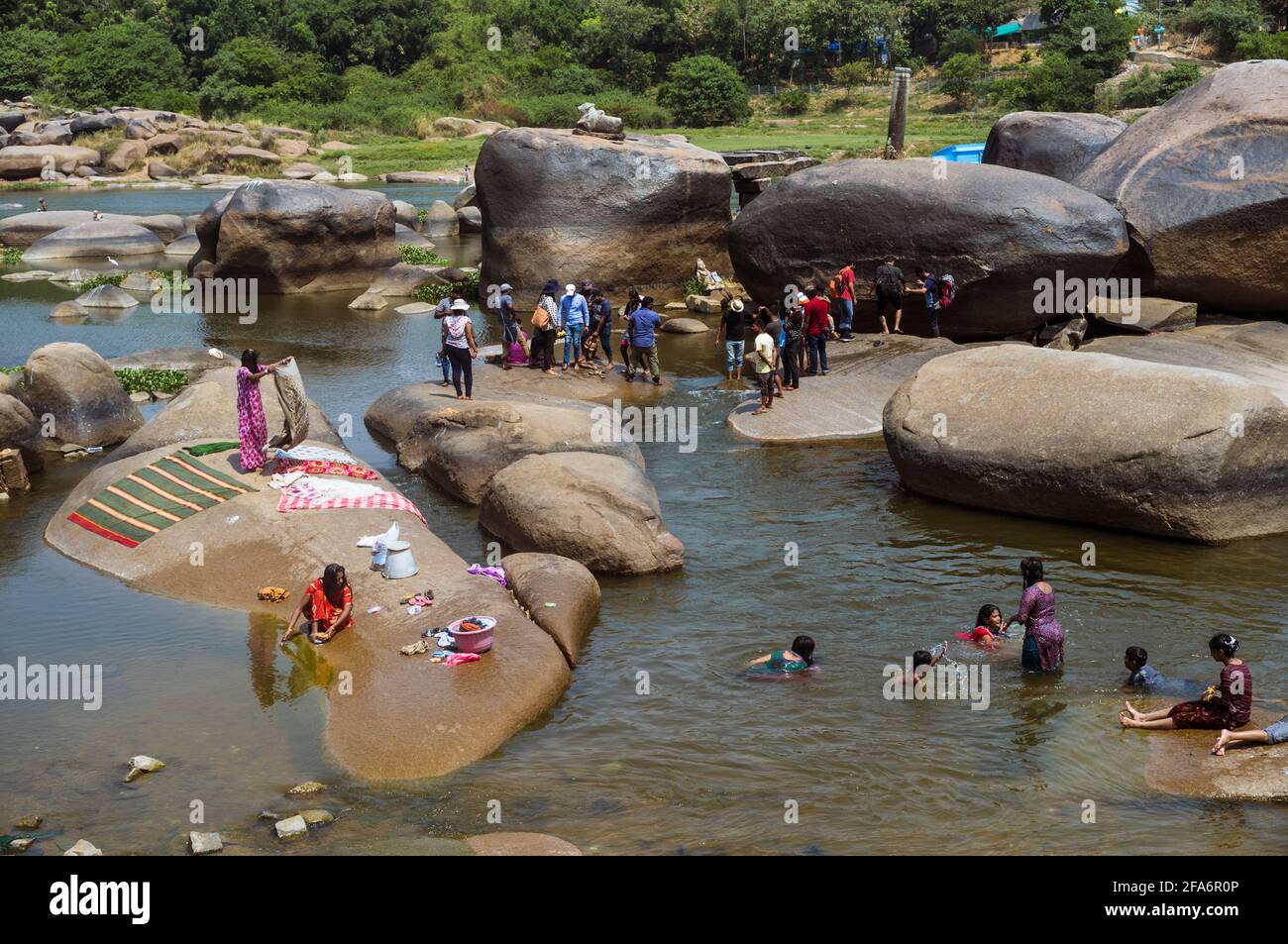 Women washing clothes on rocks hi-res stock photography and images - Alamy
