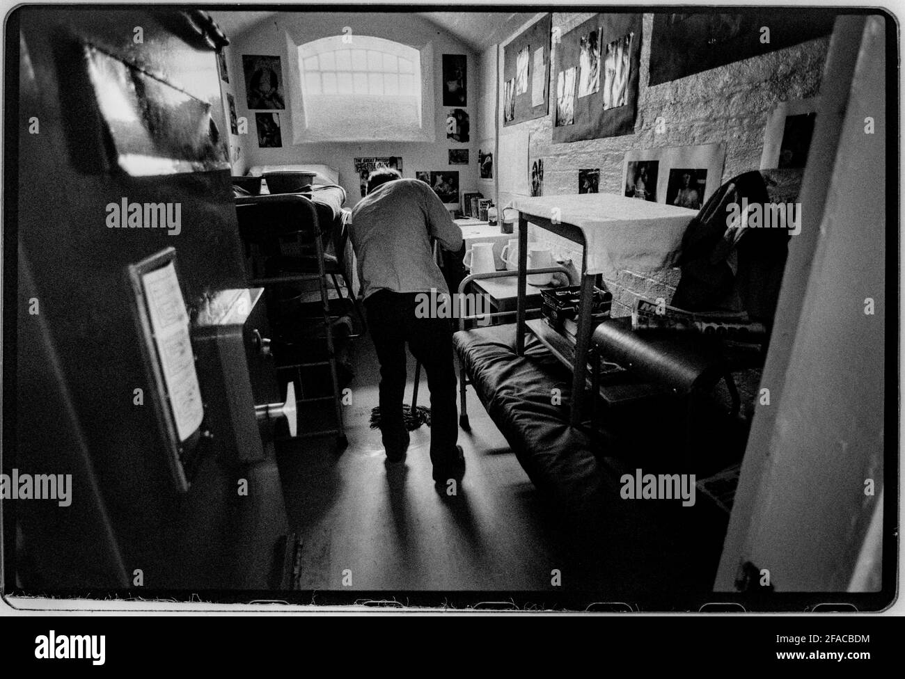 Hull Prison July 1990 Scan made in 2021 Cleaning the wing. HM Prison Hull last prison in the UK to have ‘slopping out’. This was the reason that the photographer was allowed in to document. Pictures taken with permission. Hull Prison opened in 1870, and is of a typical Victorian design HMP Hull is a Category B men's local prison located in Kingston upon Hull in the East Riding of Yorkshire, England. The term 'local' means that this prison holds people on remand to the local courts. The prison is operated by Her Majesty's Prison Service. Stock Photo