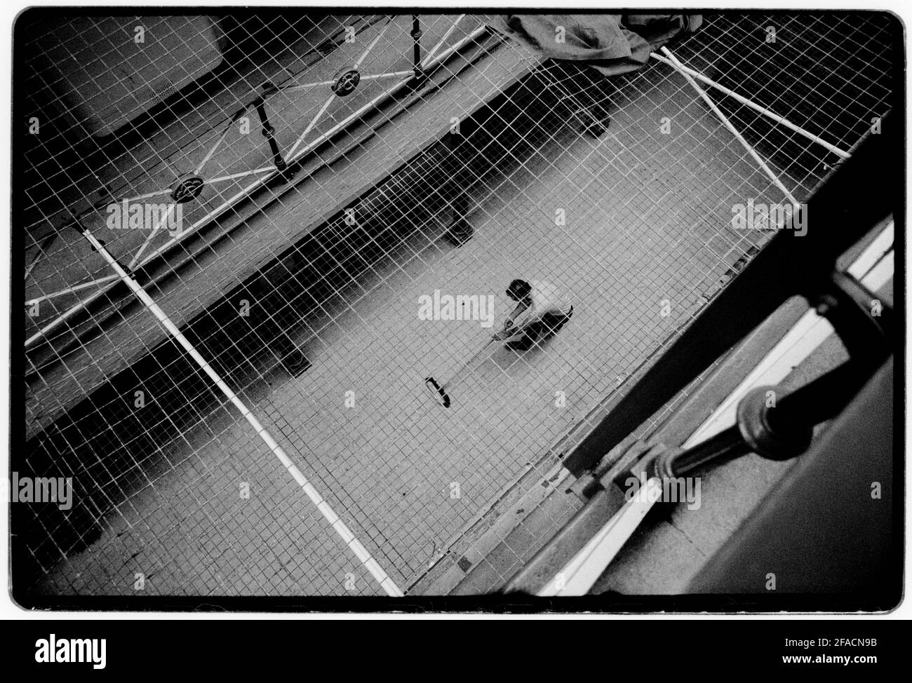 Hull Prison July 1990 Scan made in 2021 Cleaning the wing. HM Prison Hull last prison in the UK to have ‘slopping out’. This was the reason that the photographer was allowed in to document. Pictures taken with permission. Hull Prison opened in 1870, and is of a typical Victorian design HMP Hull is a Category B men's local prison located in Kingston upon Hull in the East Riding of Yorkshire, England. The term 'local' means that this prison holds people on remand to the local courts. The prison is operated by Her Majesty's Prison Service. Stock Photo