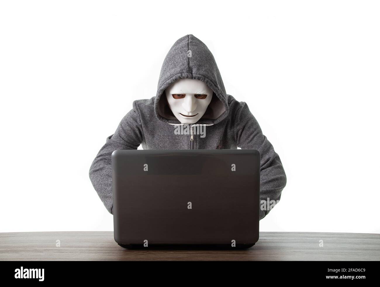 Professional hacker with laptop isolated on white background Stock Photo