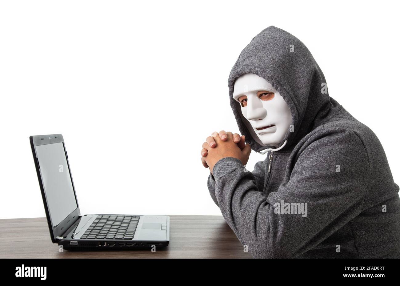 Professional hacker with laptop isolated on white background Stock Photo